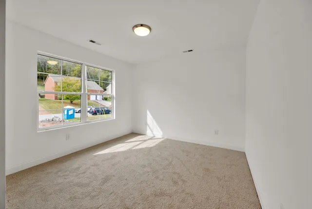 a view of wooden deck and a yard