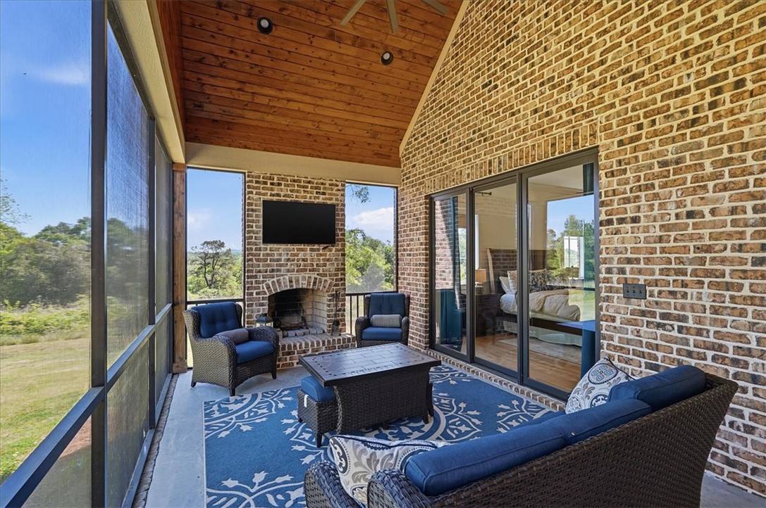 724 Red Hill Road Pickens, SC 29671 - Photo 13 of 50 Screened porch with fireplace just off primary bedroom