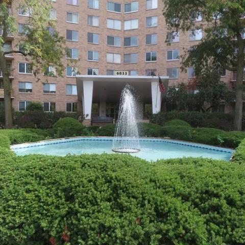 a front view of a building with garden