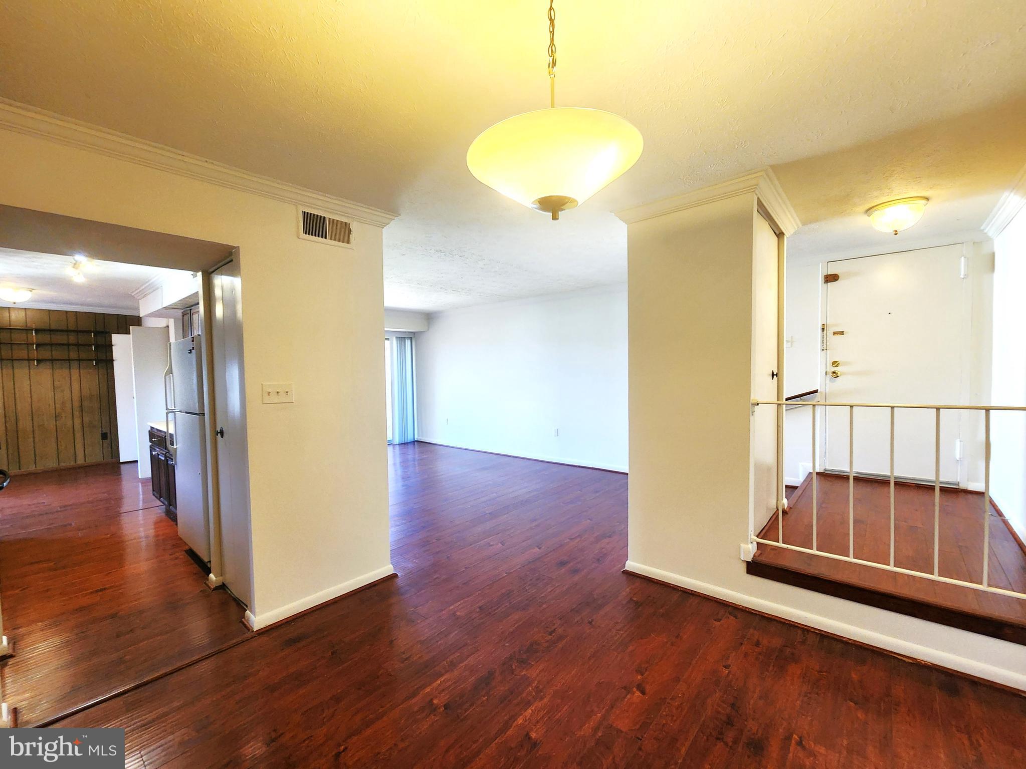 7919 Mandan Road, Unit 304 Greenbelt, MD 20770 - Photo 11 of 21 a view of a room with wooden floor