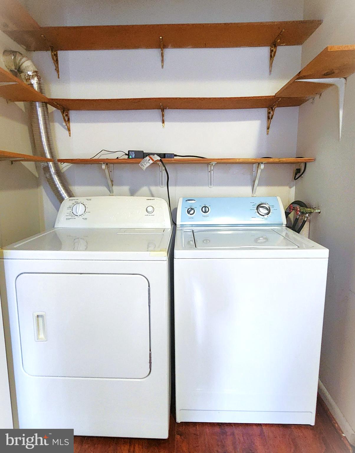 7919 Mandan Road, Unit 304 Greenbelt, MD 20770 - Photo 19 of 21 a utility room with dryer and washer