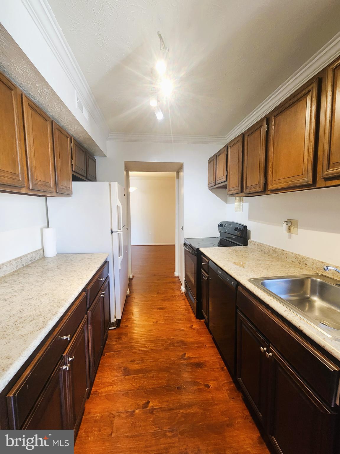 7919 Mandan Road, Unit 304 Greenbelt, MD 20770 - Photo 6 of 21 a large kitchen with granite countertop lots of counter top space