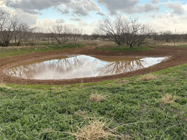 a view of a lake with a big yard