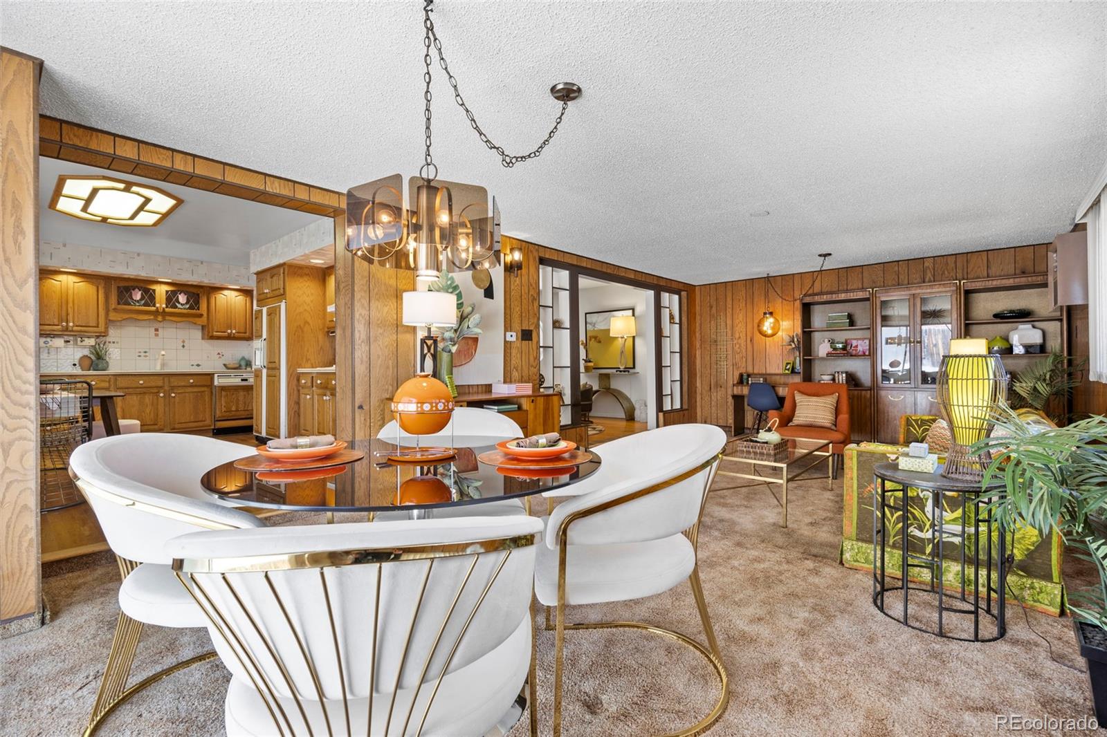 385 South Kearney Street Denver, CO 80224 - Photo 15 of 43 a dining room with furniture a chandelier and a rug