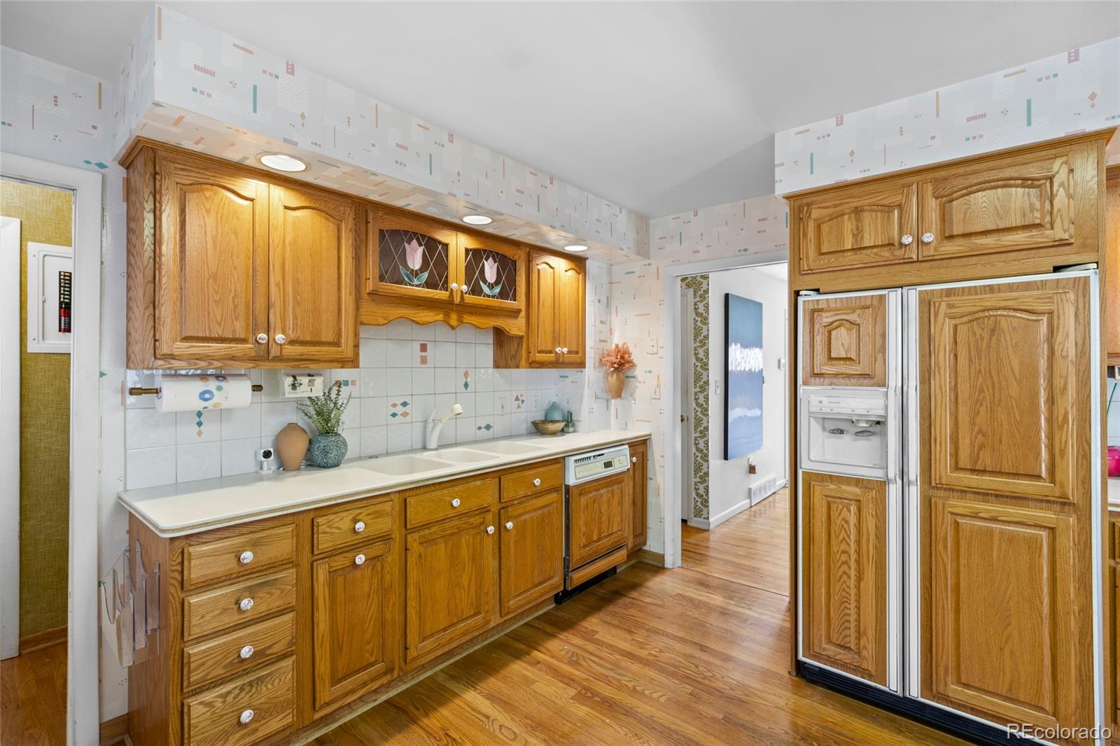 385 South Kearney Street Denver, CO 80224 - Photo 17 of 43 a kitchen with stainless steel appliances granite countertop a refrigerator and a stove