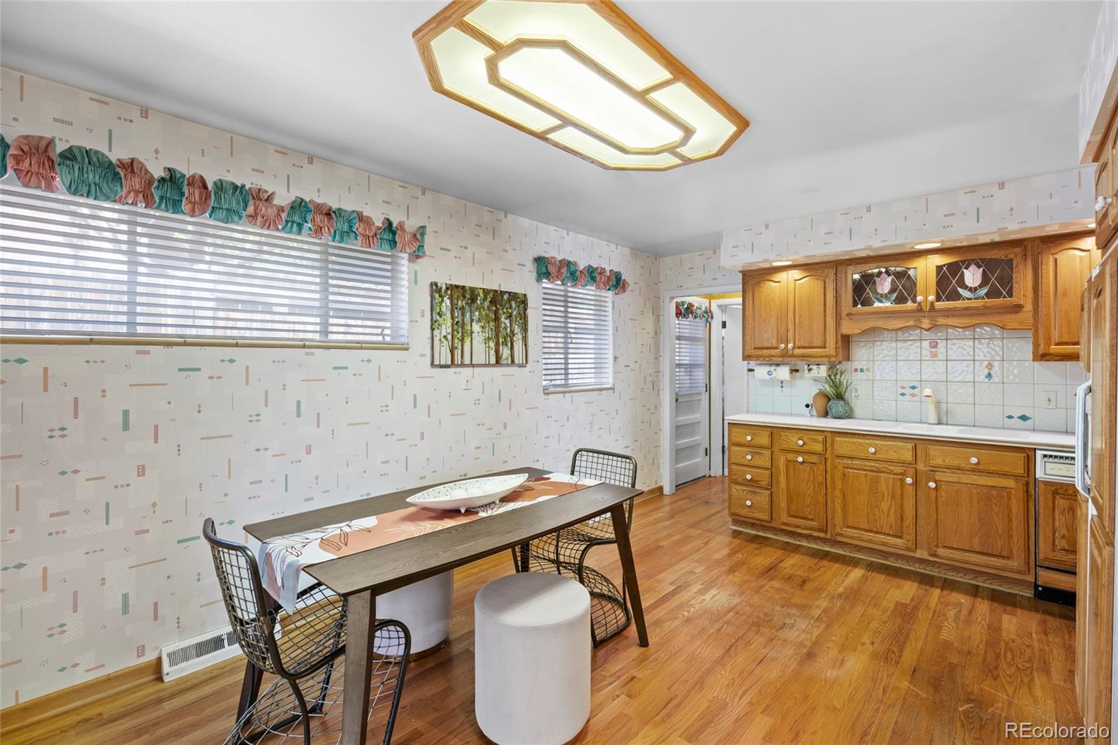 385 South Kearney Street Denver, CO 80224 - Photo 20 of 43 a kitchen with a table and chairs in it
