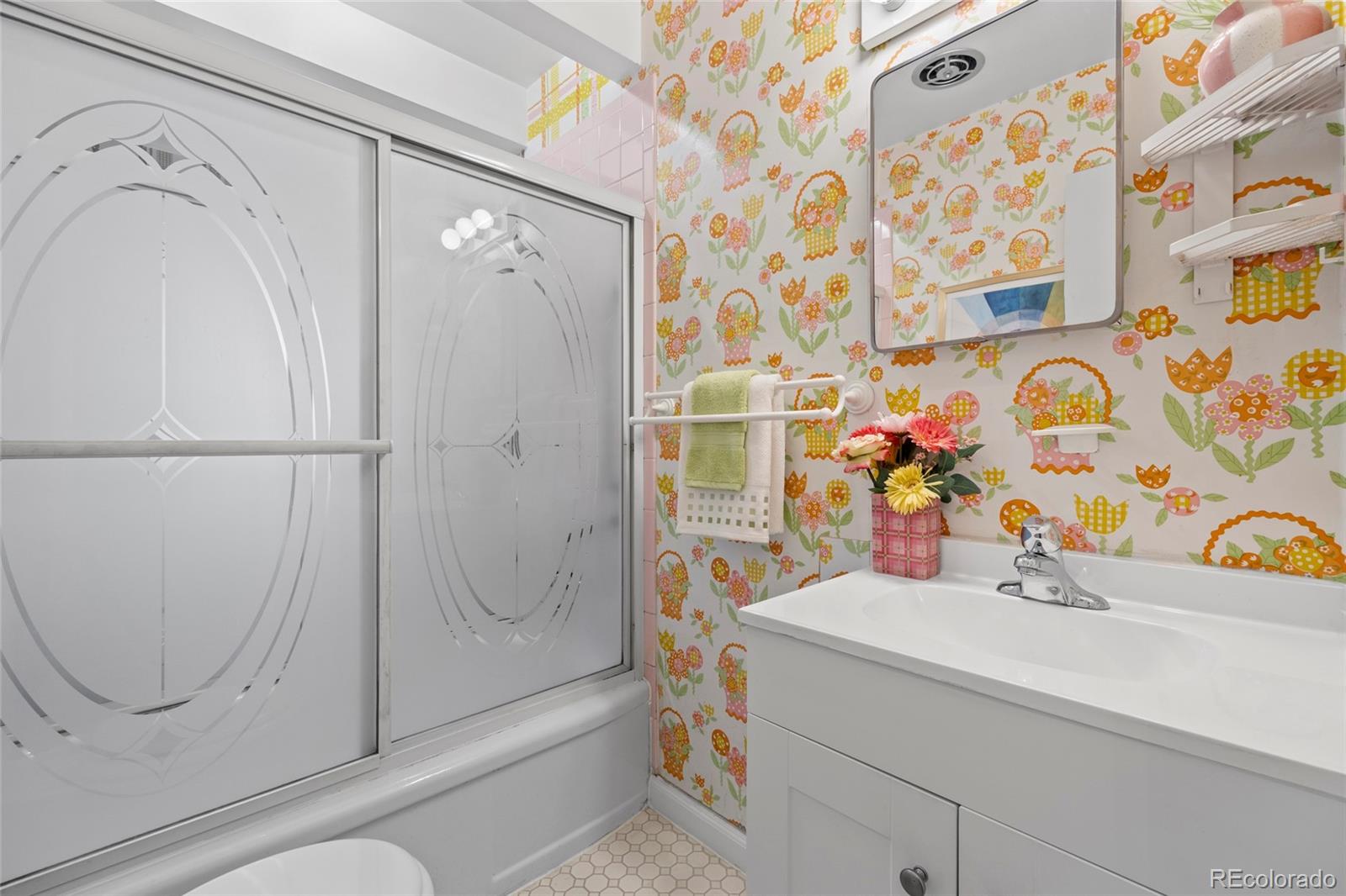 385 South Kearney Street Denver, CO 80224 - Photo 26 of 43 a bathroom with a sink and a mirror