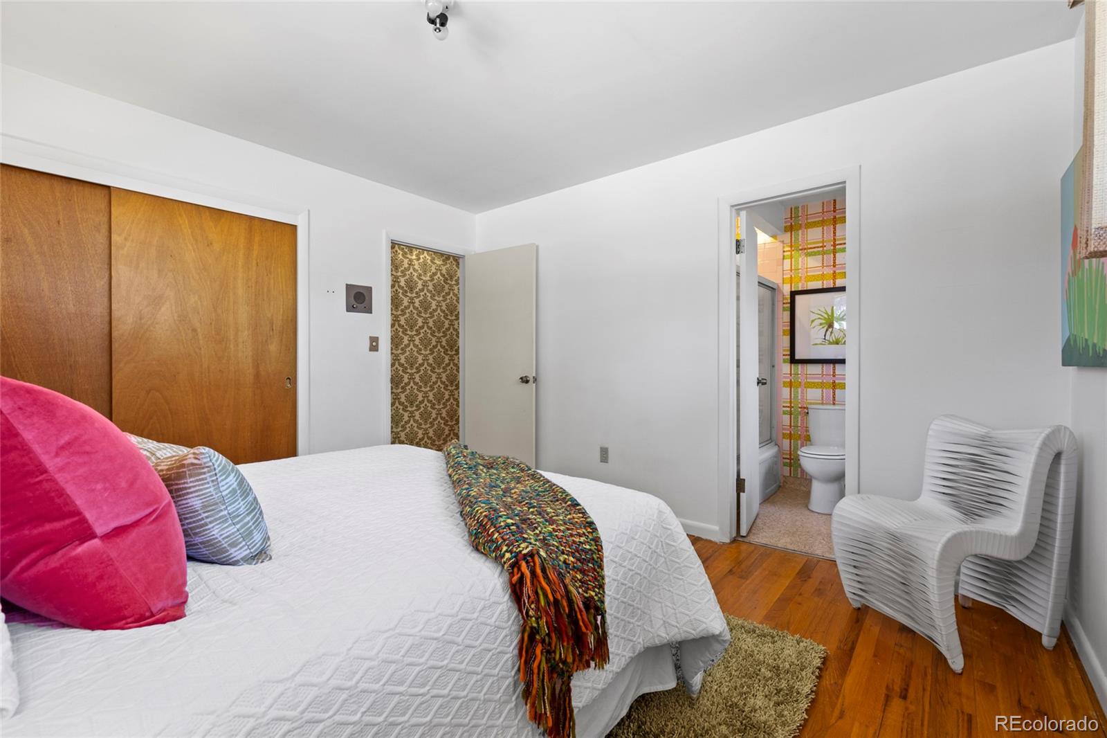 385 South Kearney Street Denver, CO 80224 - Photo 28 of 43 a bedroom with a bed and chair