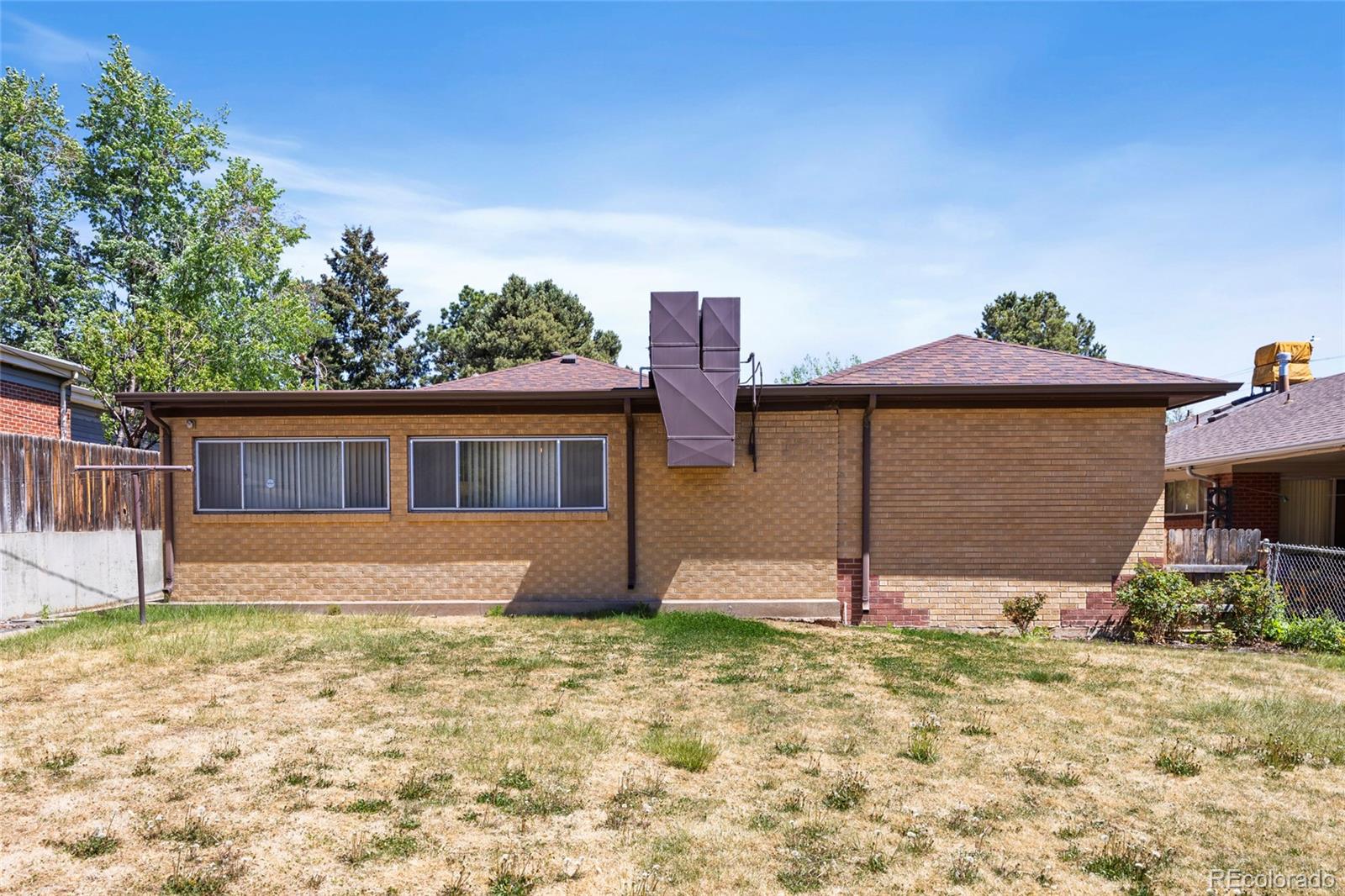 385 South Kearney Street Denver, CO 80224 - Photo 39 of 43 a house that has a tree in front of it