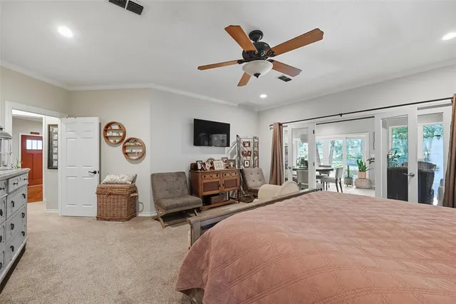 a bed room with a bed and a large window