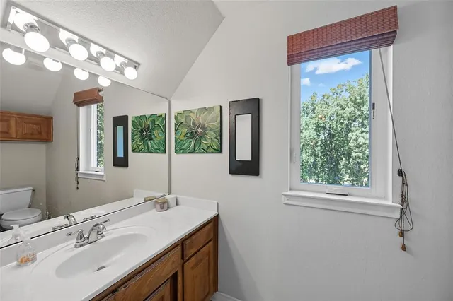 a bathroom with a sink and a window