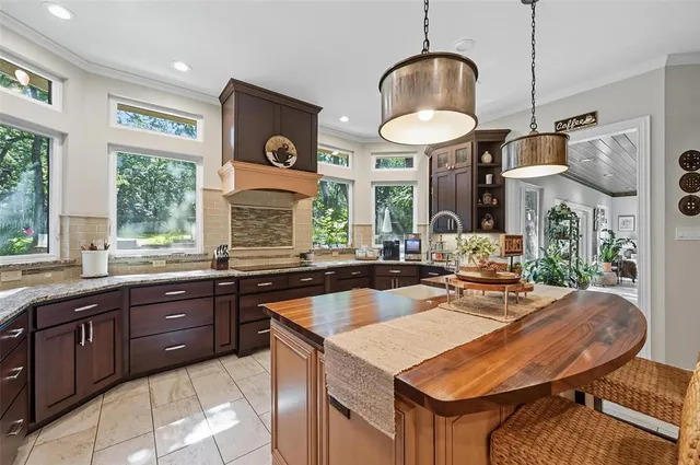 a kitchen with a stove a sink and a refrigerator