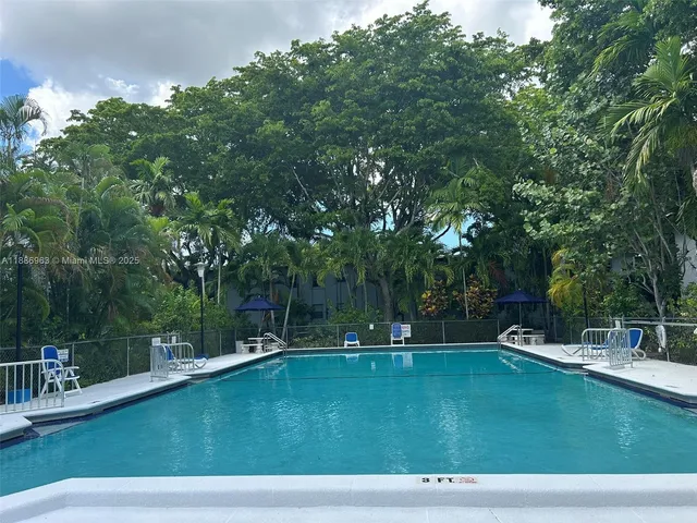 a view of a swimming pool with a patio