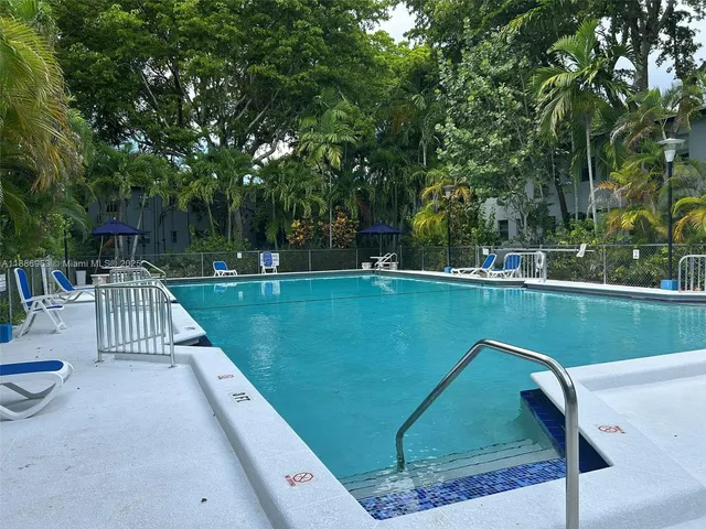a view of swimming pool with a patio