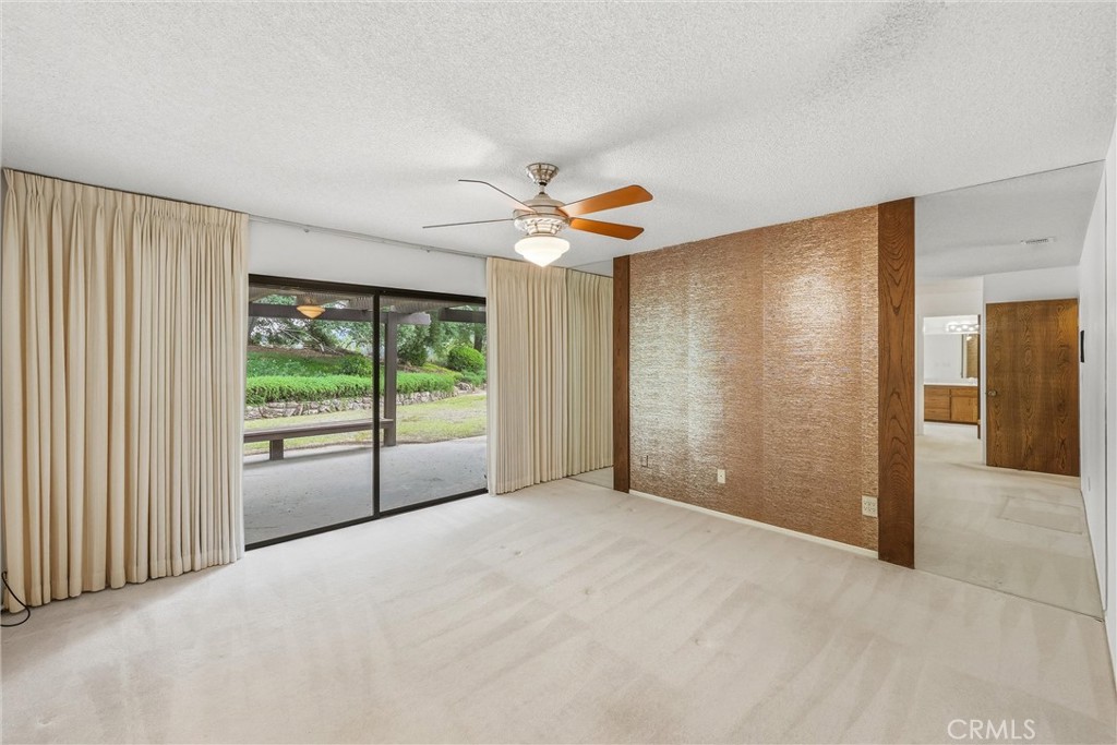 37295 Oak View Road Yucaipa, CA 92399 - Photo 30 of 59 a view of a livingroom with a ceiling fan and window