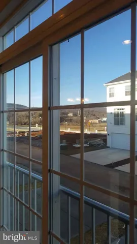 a room with walk in closet and window