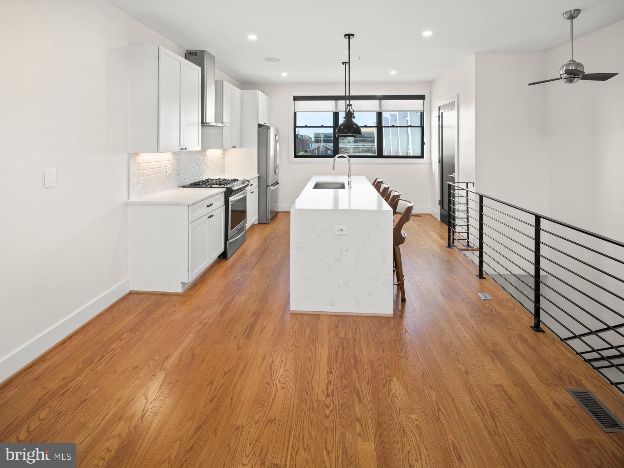 609 Gresham Place Northwest, Unit 2 Washington, DC 20001 - Photo 20 of 35 a view of kitchen with sink and wooden floor