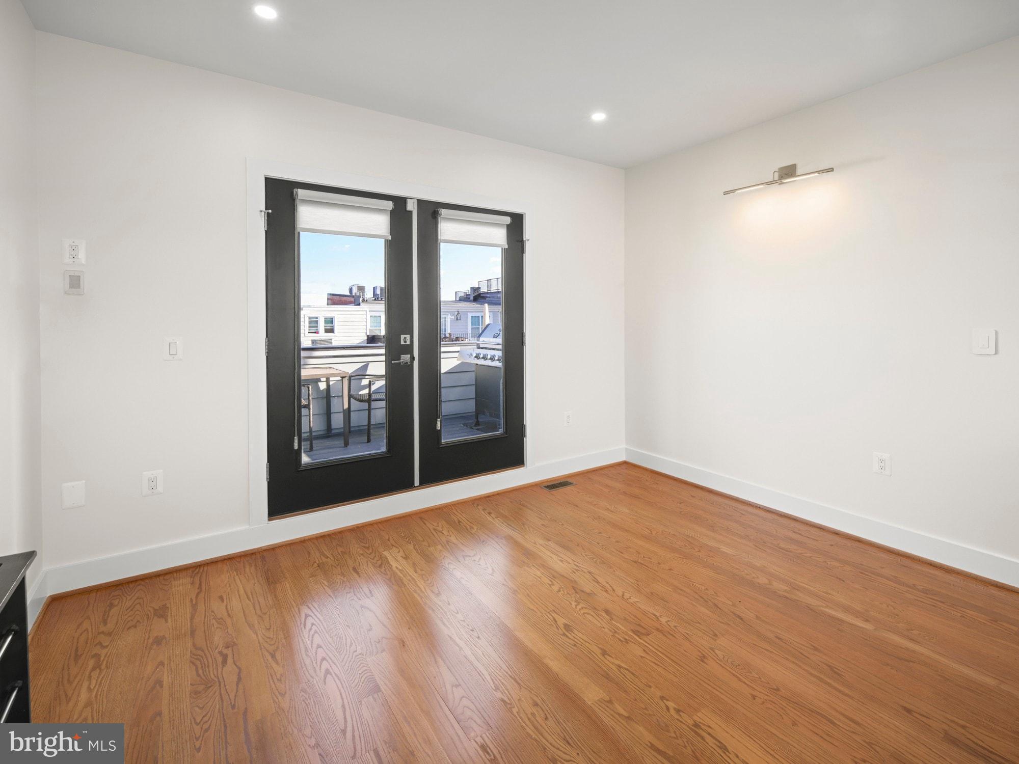 609 Gresham Place Northwest, Unit 2 Washington, DC 20001 - Photo 26 of 35 a view of an empty room with glass door