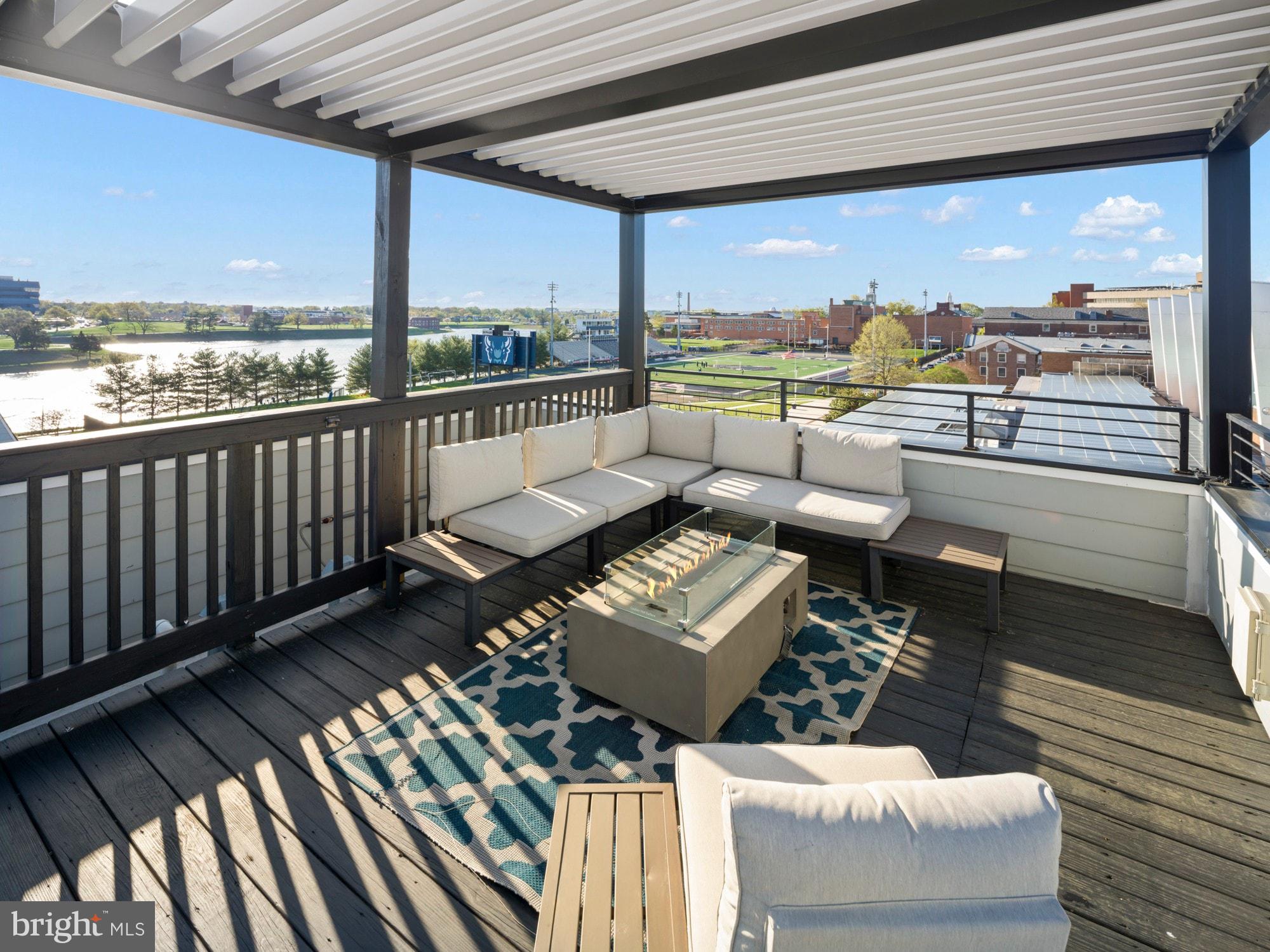 609 Gresham Place Northwest, Unit 2 Washington, DC 20001 - Photo 29 of 35 a balcony with wooden floor and outdoor seating