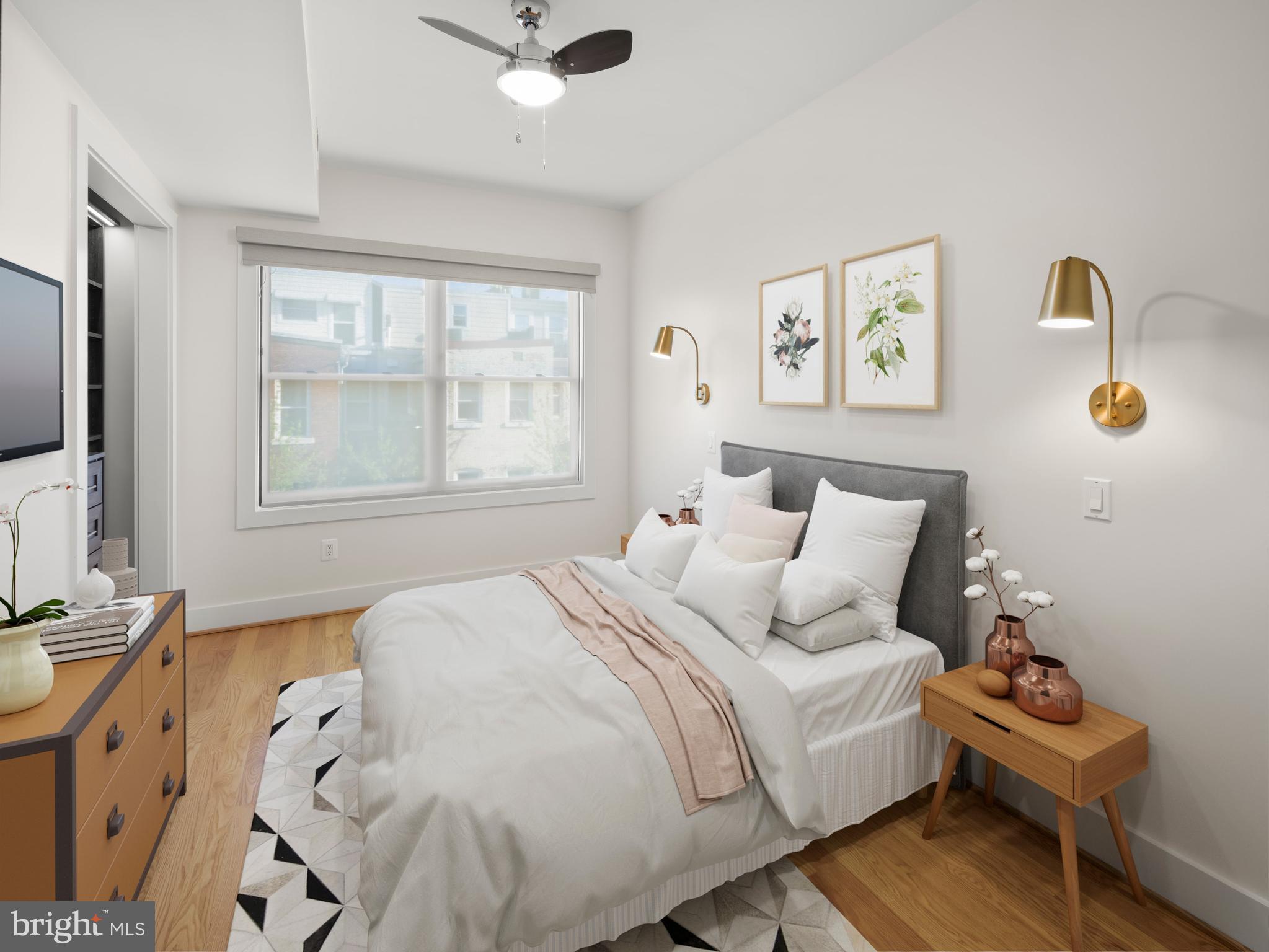 609 Gresham Place Northwest, Unit 2 Washington, DC 20001 - Photo 3 of 35 a bedroom with a bed wooden floor and window