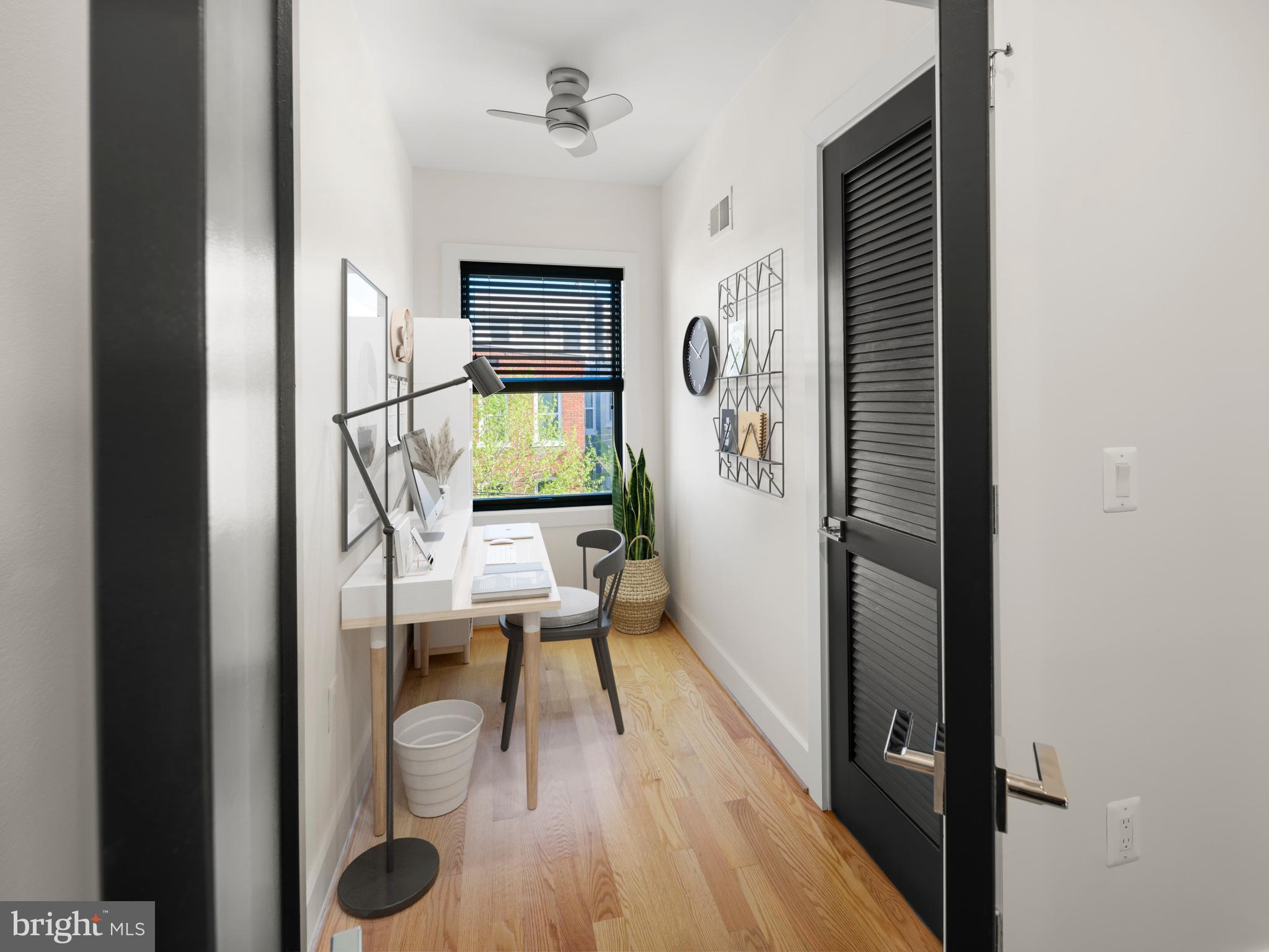 609 Gresham Place Northwest, Unit 2 Washington, DC 20001 - Photo 6 of 35 a view of a hallway with wooden floor fireplace and living room