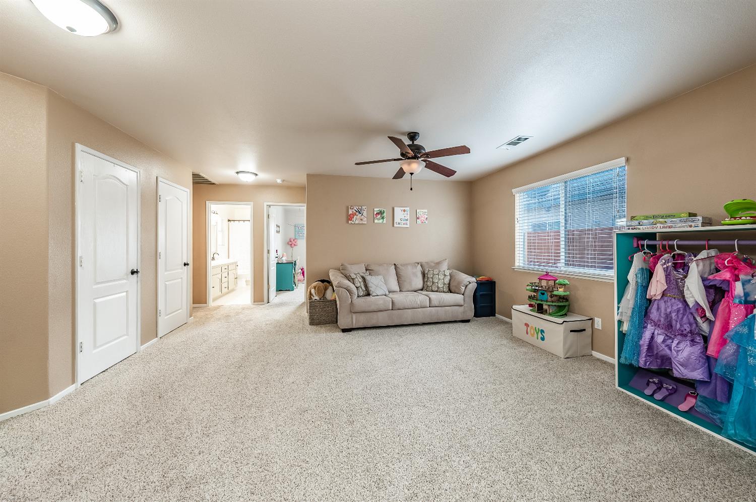 695 Crescent Lane Lemoore, CA 93245 - Photo 19 of 47 a living room with furniture and a flat screen tv