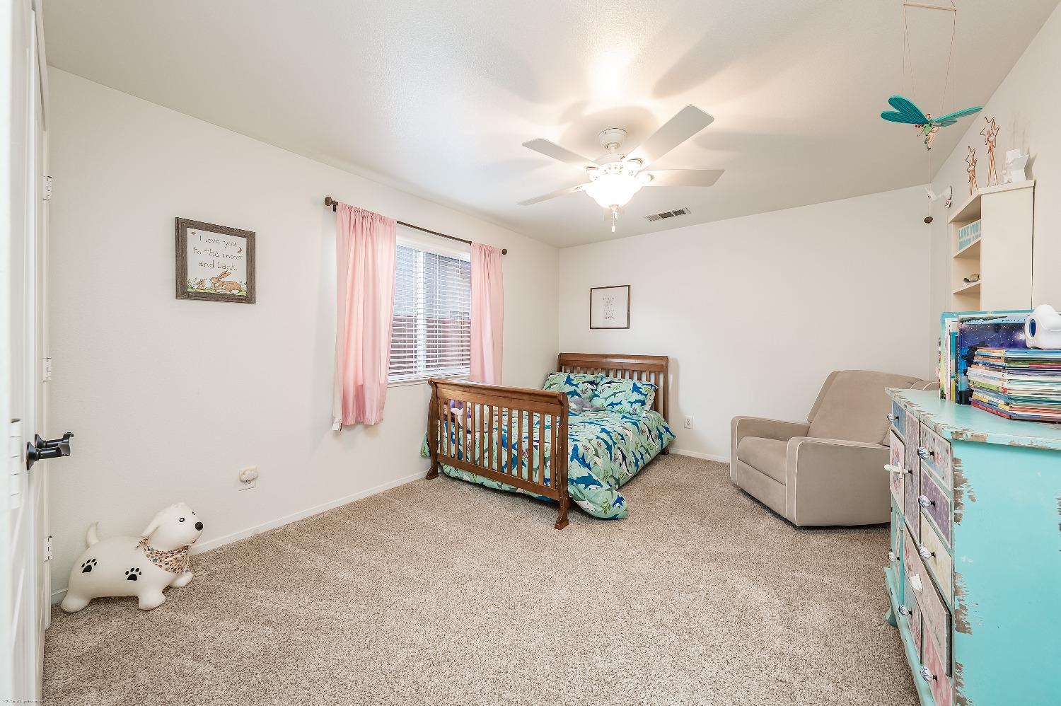 695 Crescent Lane Lemoore, CA 93245 - Photo 20 of 47 a living room with furniture and a window