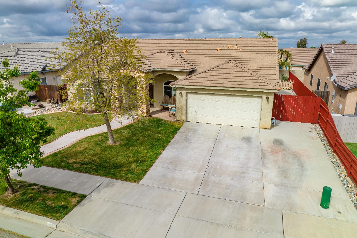 695 Crescent Lane Lemoore, CA 93245 - Photo 2 of 47 a view of a house with a yard