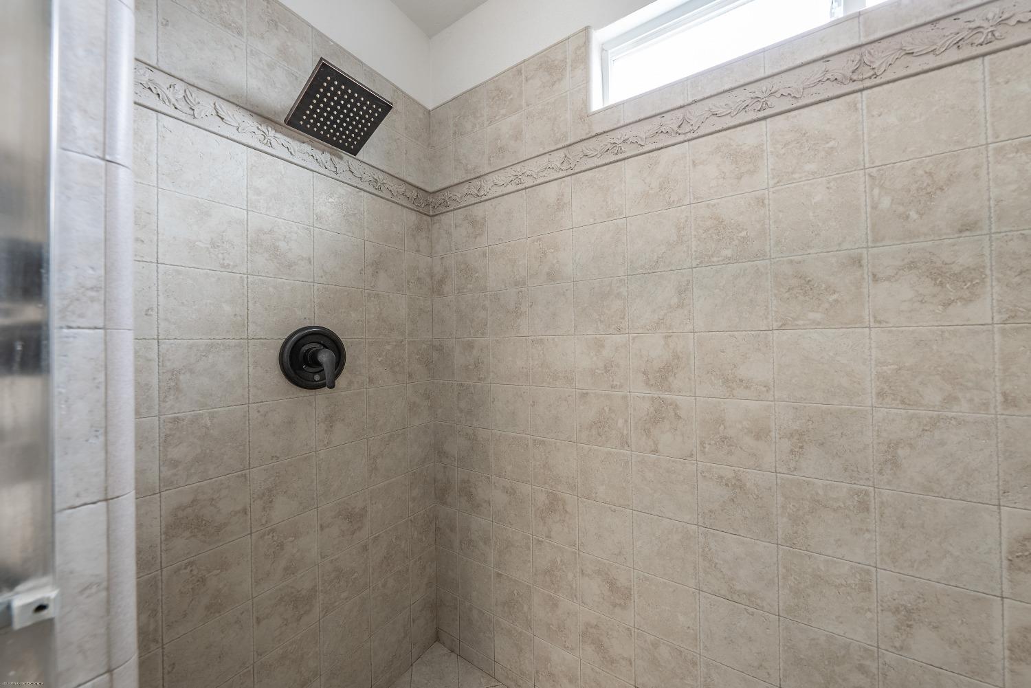 695 Crescent Lane Lemoore, CA 93245 - Photo 26 of 47 a bathroom with a shower