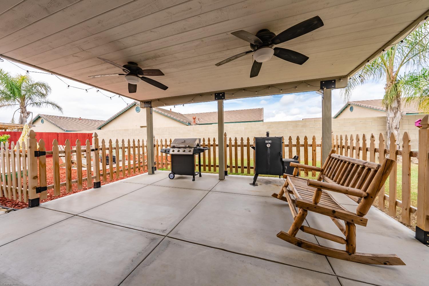 695 Crescent Lane Lemoore, CA 93245 - Photo 28 of 47 a view of a porch with furniture