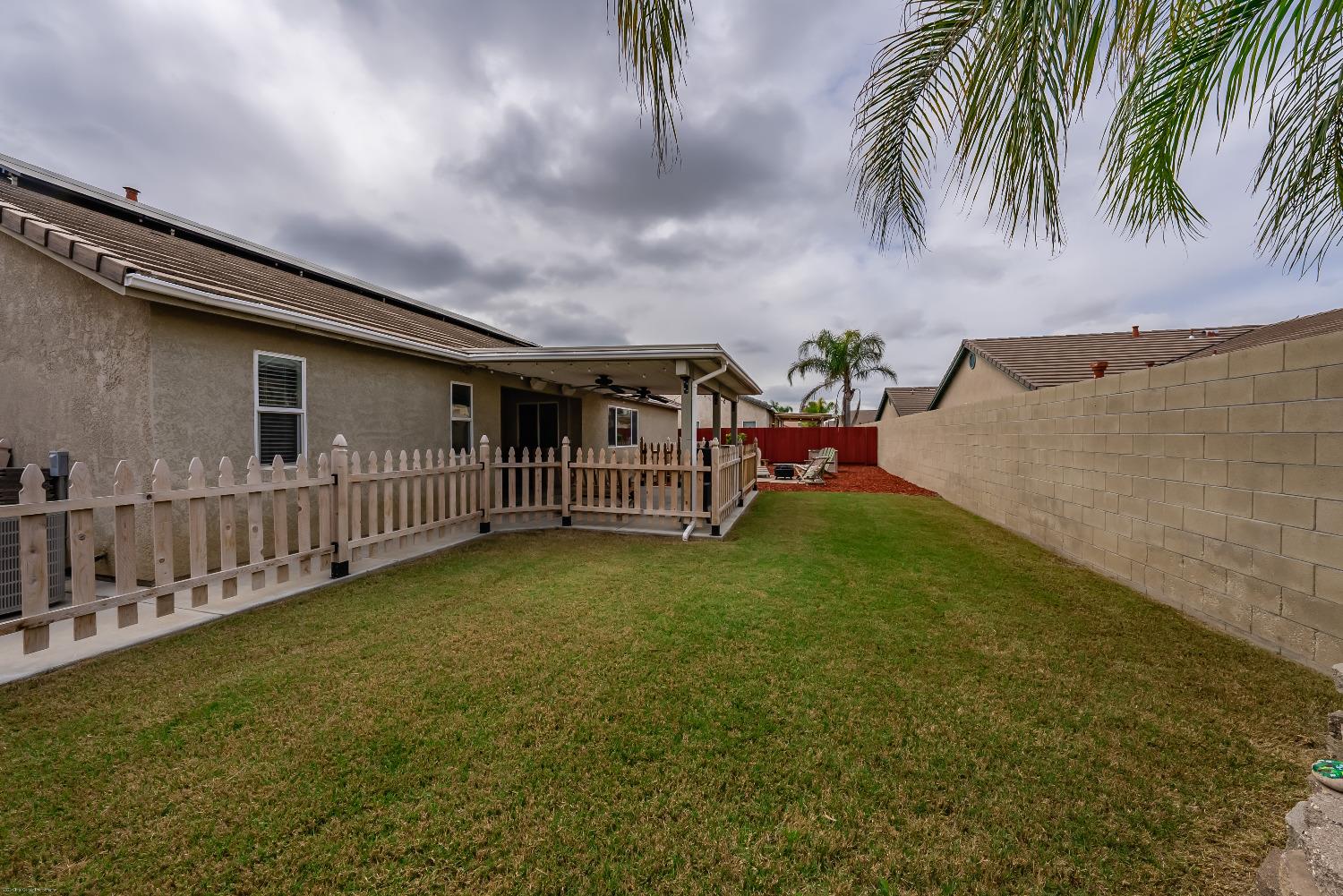 695 Crescent Lane Lemoore, CA 93245 - Photo 34 of 47 a view of a porch with furniture and garden