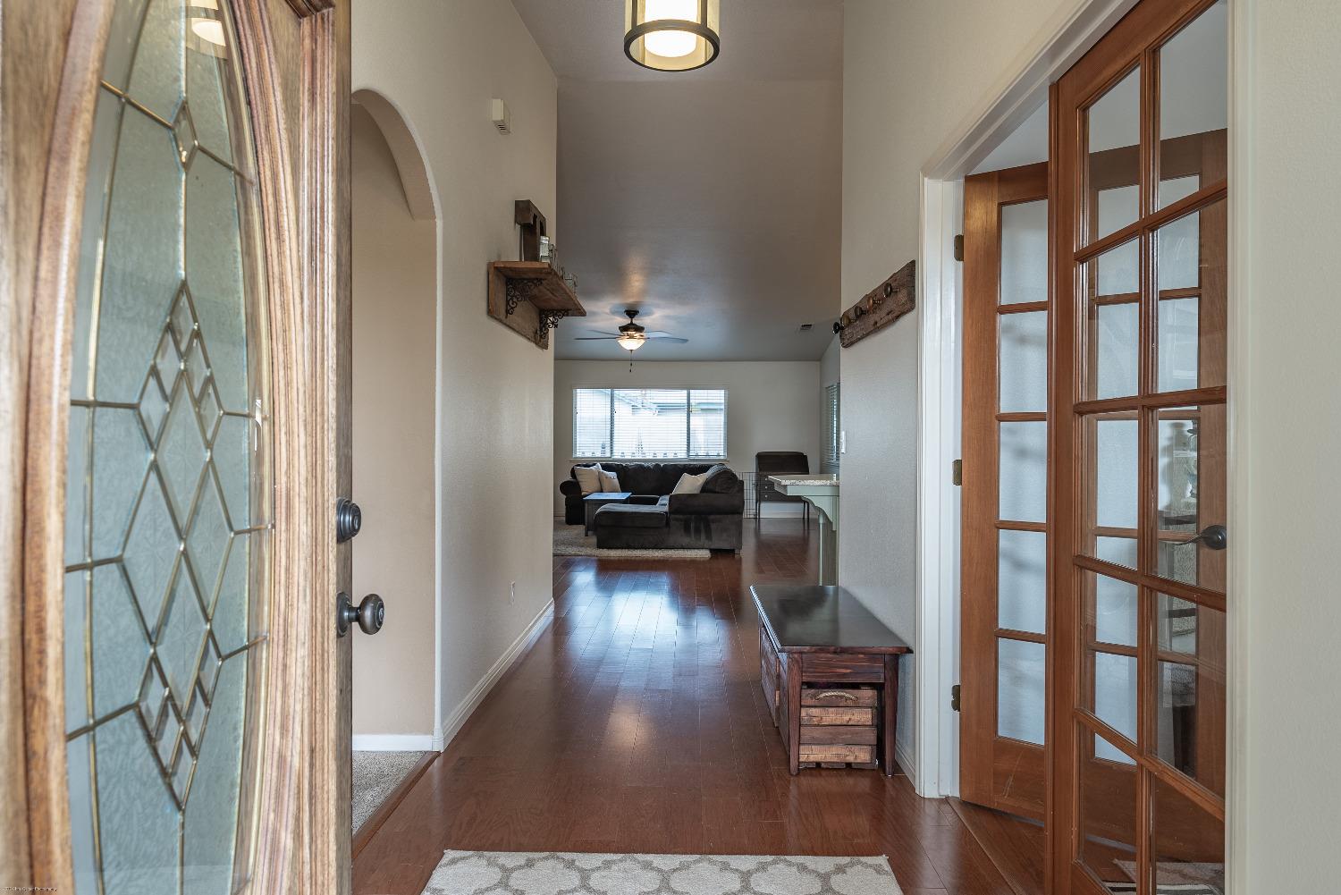 695 Crescent Lane Lemoore, CA 93245 - Photo 4 of 47 a view of entryway and hall with wooden floor