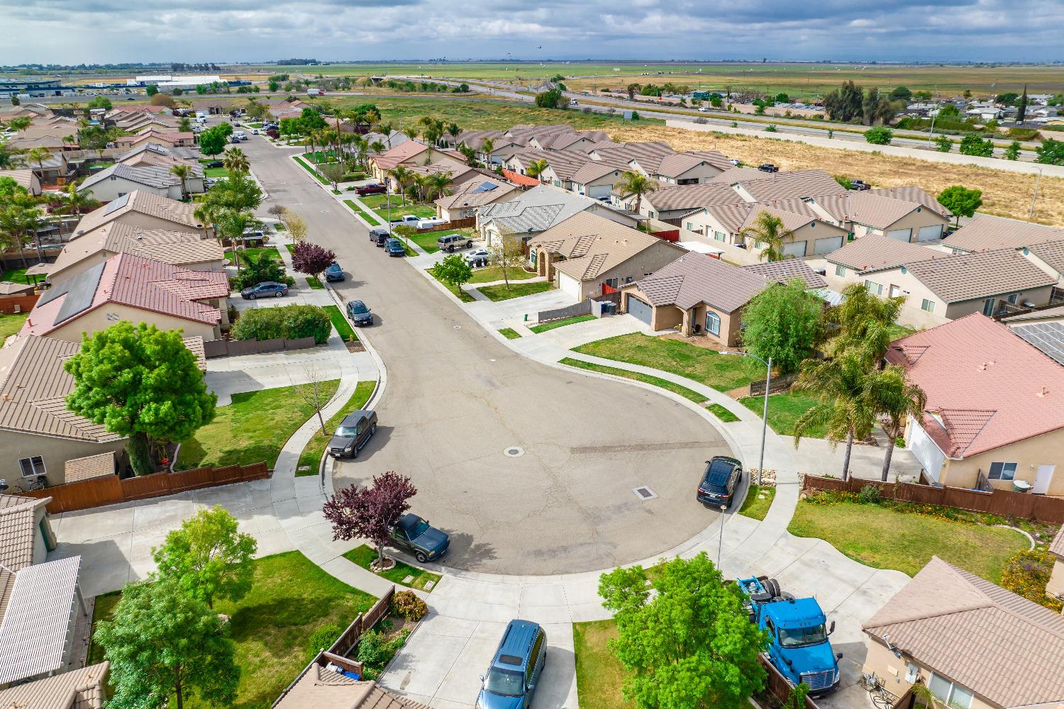 695 Crescent Lane Lemoore, CA 93245 - Photo 46 of 47 an aerial view of residential houses with outdoor space