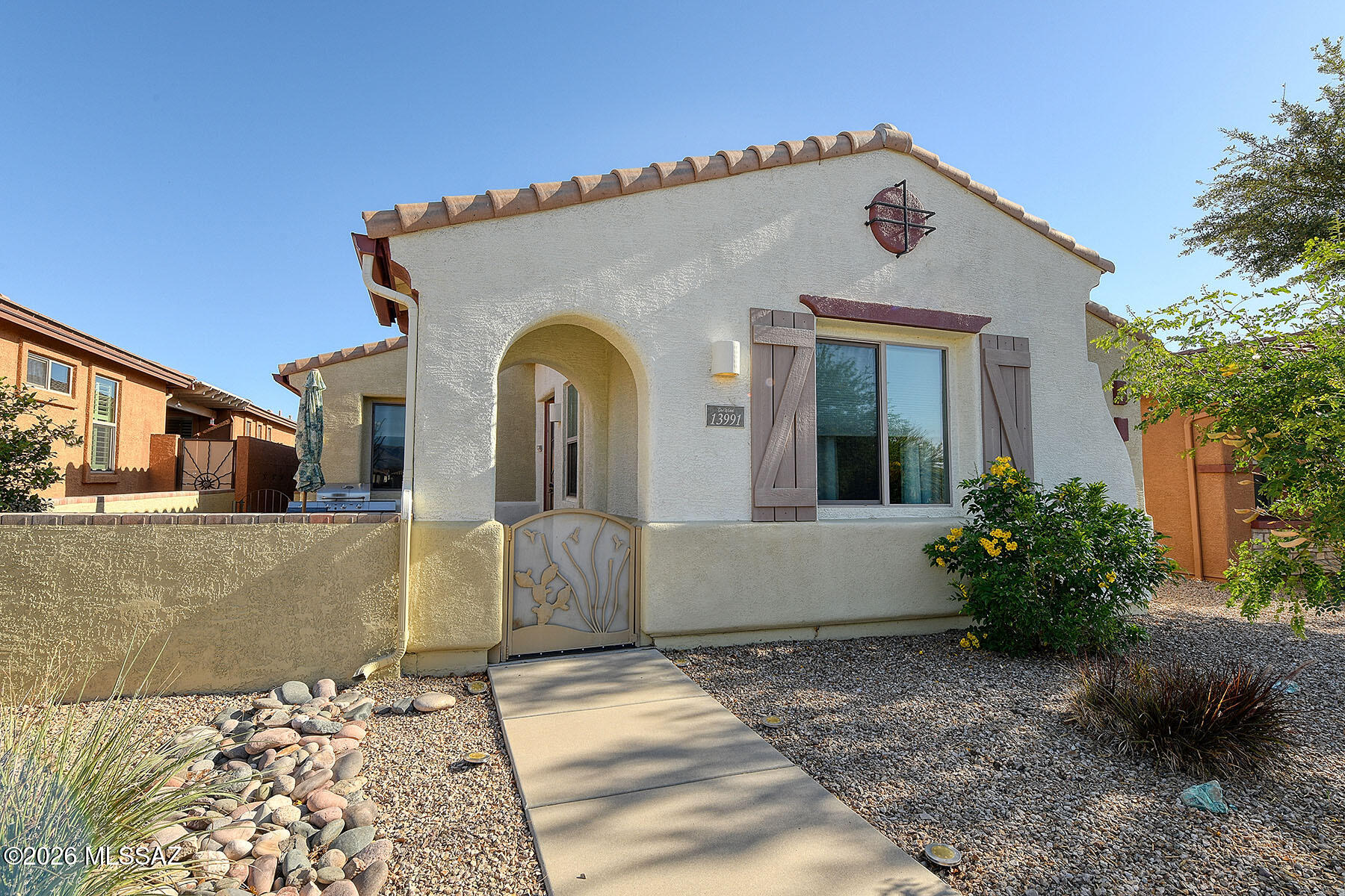 13991 East Cheavront Loop Vail, AZ 85641 - Photo 2 of 47 a view of a house with large windows