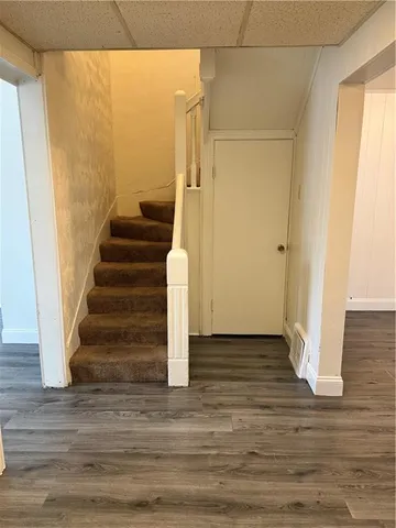 a view of entryway with wooden floor