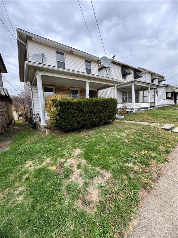 133 Sherman Avenue Vandergrift, PA 15690 - Photo 2 of 16 a front view of a house with a garden