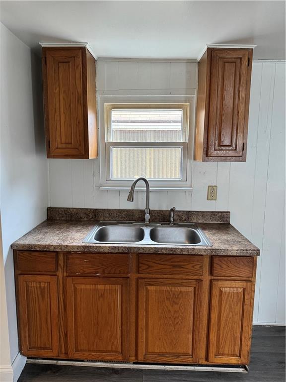 133 Sherman Avenue Vandergrift, PA 15690 - Photo 6 of 16 a kitchen with granite countertop a sink and cabinets