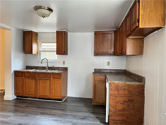 a kitchen with granite countertop cabinets and a sink