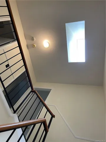 a view of an empty room with stairs