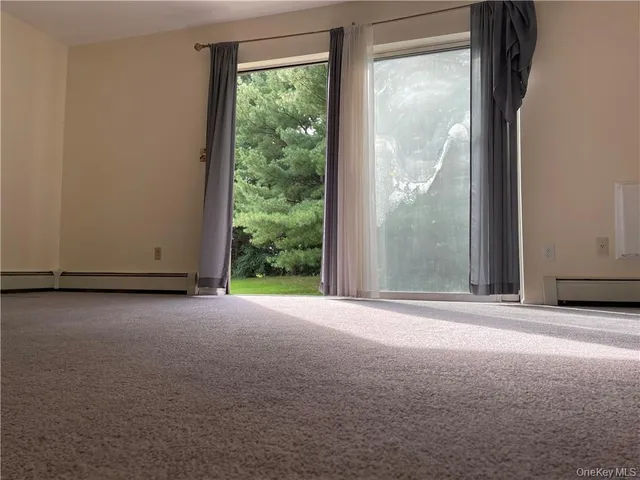 a view of a room with a large window