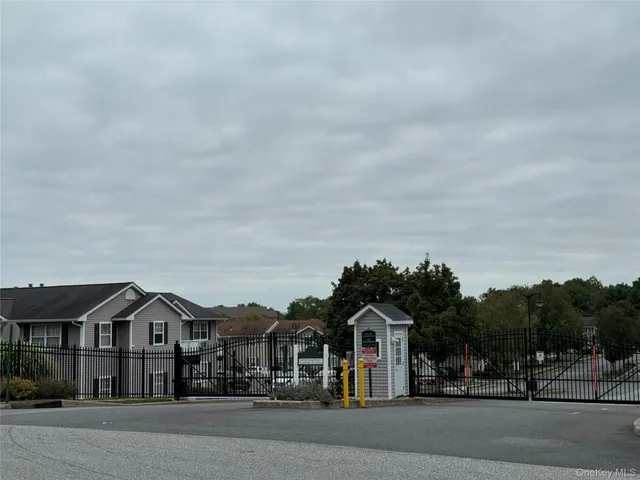a view of houses with a street