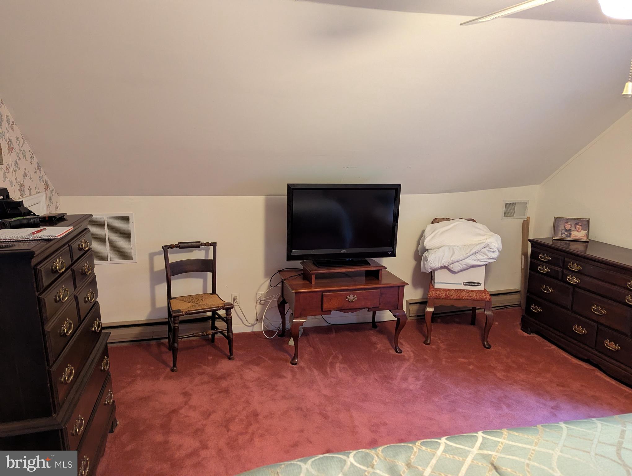 1475 Woodstock Road Woodstock, MD 21163 - Photo 12 of 26 a living room with furniture and a flat screen tv
