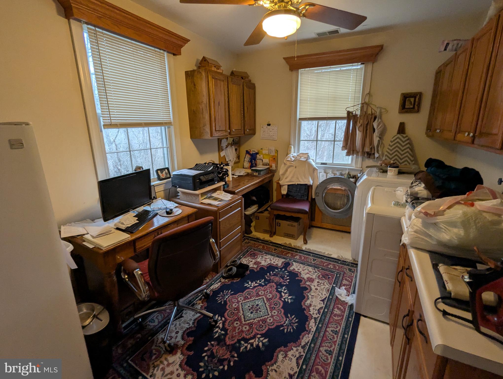 1475 Woodstock Road Woodstock, MD 21163 - Photo 15 of 26 a view of a workspace with furniture and a window