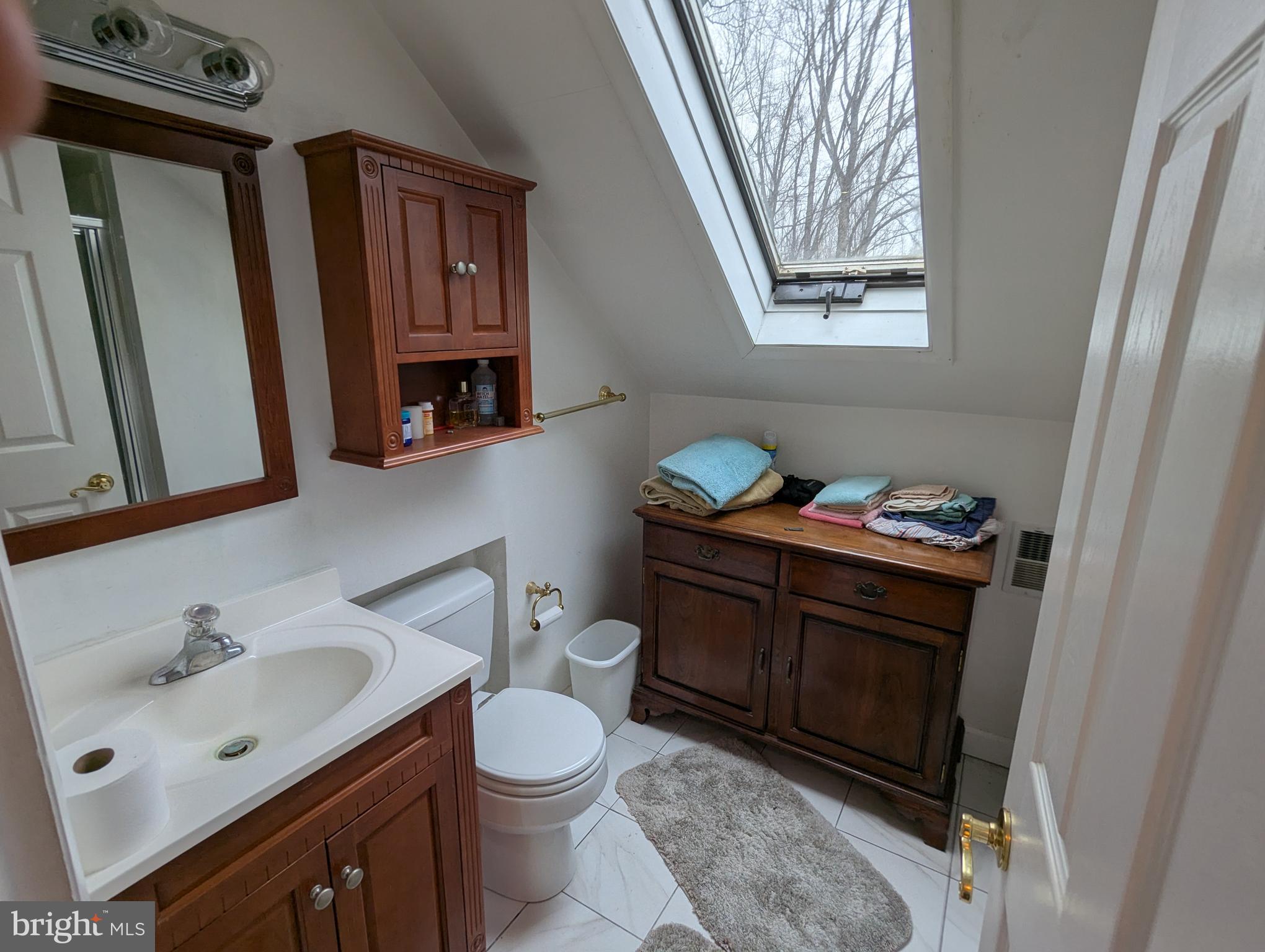 1475 Woodstock Road Woodstock, MD 21163 - Photo 17 of 26 a bathroom with a sink vanity and mirror