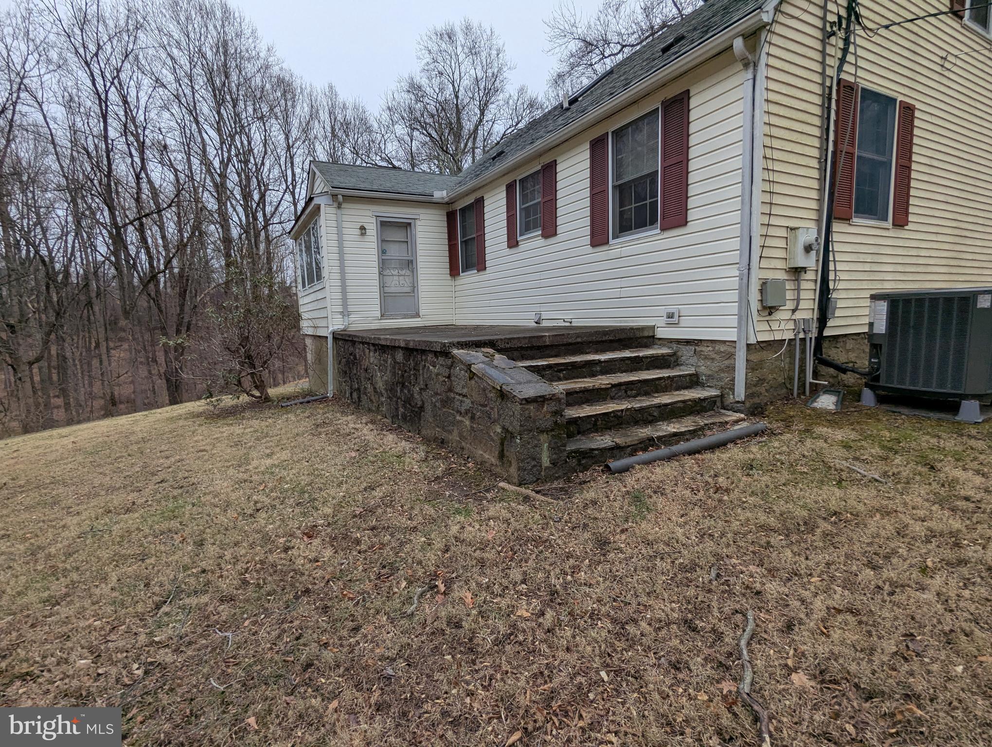 1475 Woodstock Road Woodstock, MD 21163 - Photo 20 of 26 a view of a house with a yard and wooden fence