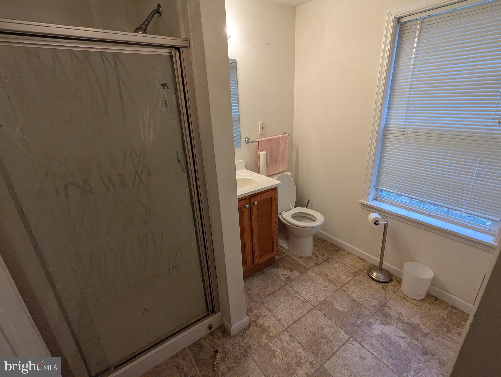 1475 Woodstock Road Woodstock, MD 21163 - Photo 25 of 26 a bathroom with a toilet and a shower