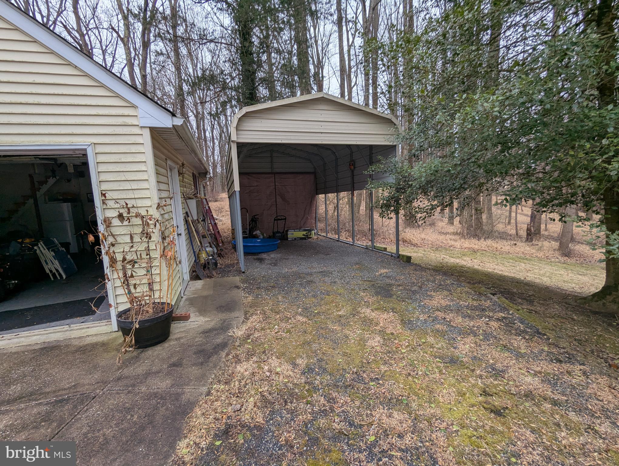 1475 Woodstock Road Woodstock, MD 21163 - Photo 26 of 26 a view of a house with backyard and barbeque area