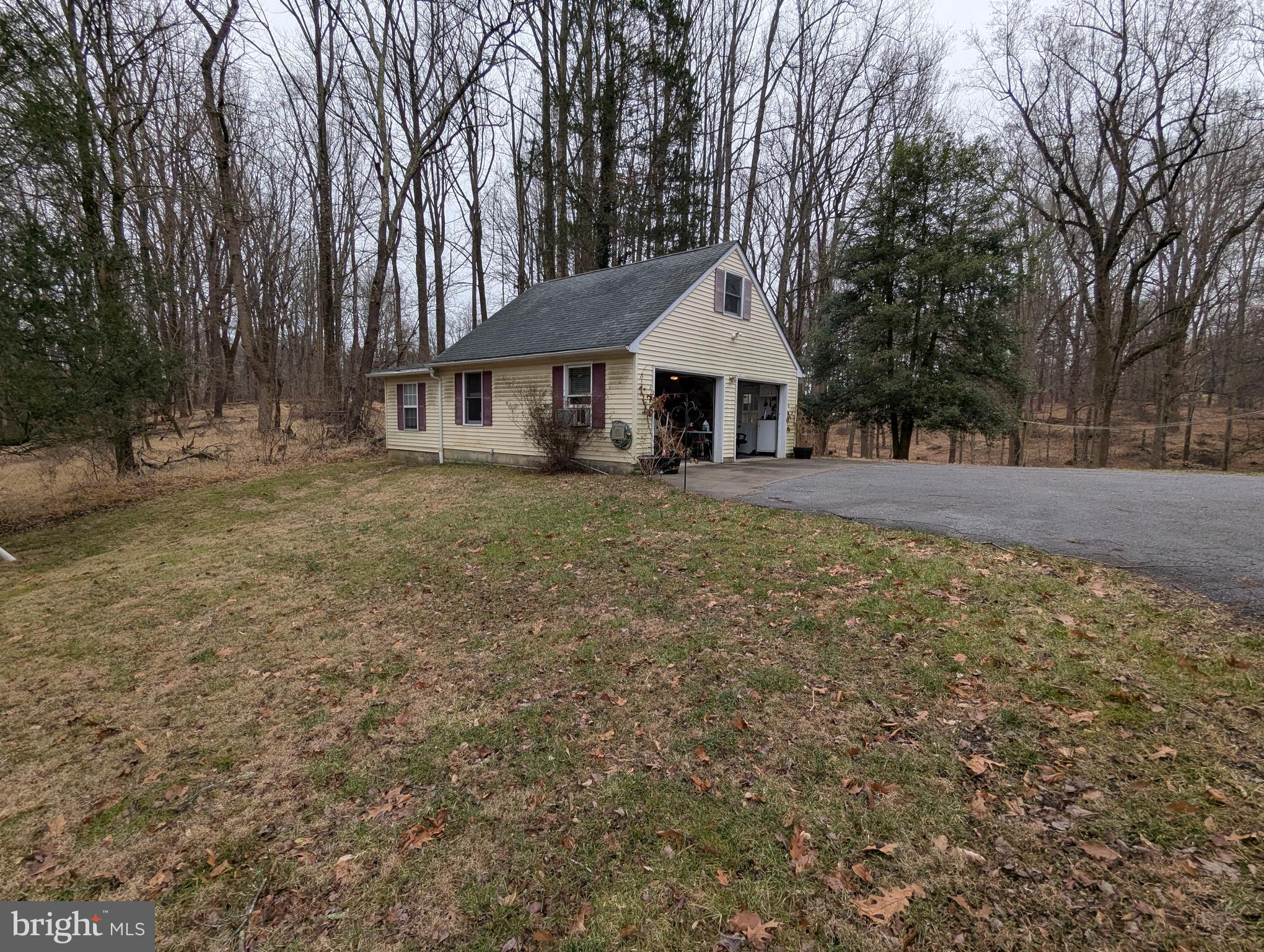 1475 Woodstock Road Woodstock, MD 21163 - Photo 3 of 26 a view of a house with a yard