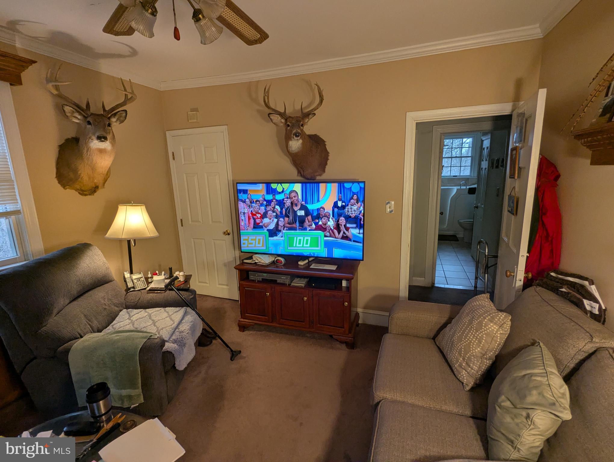 1475 Woodstock Road Woodstock, MD 21163 - Photo 10 of 26 a living room with furniture and a flat screen tv
