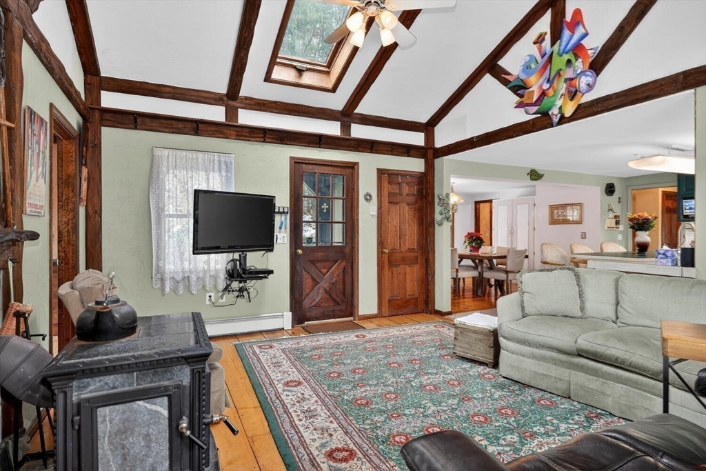 15 Rocky Pond Road Boylston, MA 01505 - Photo 22 of 39 a living room with furniture and a flat screen tv